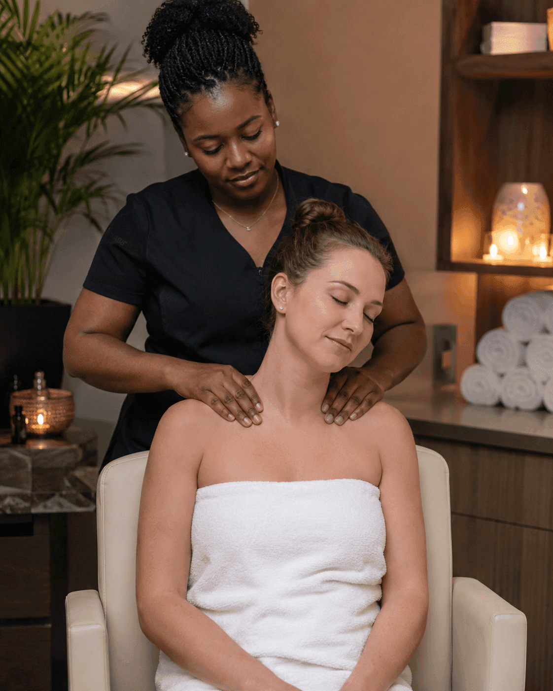Therapist applying a revitalizing natural body scrub polish during a full body exfoliation session at Galeo Beauty spa in Hartbeespoort